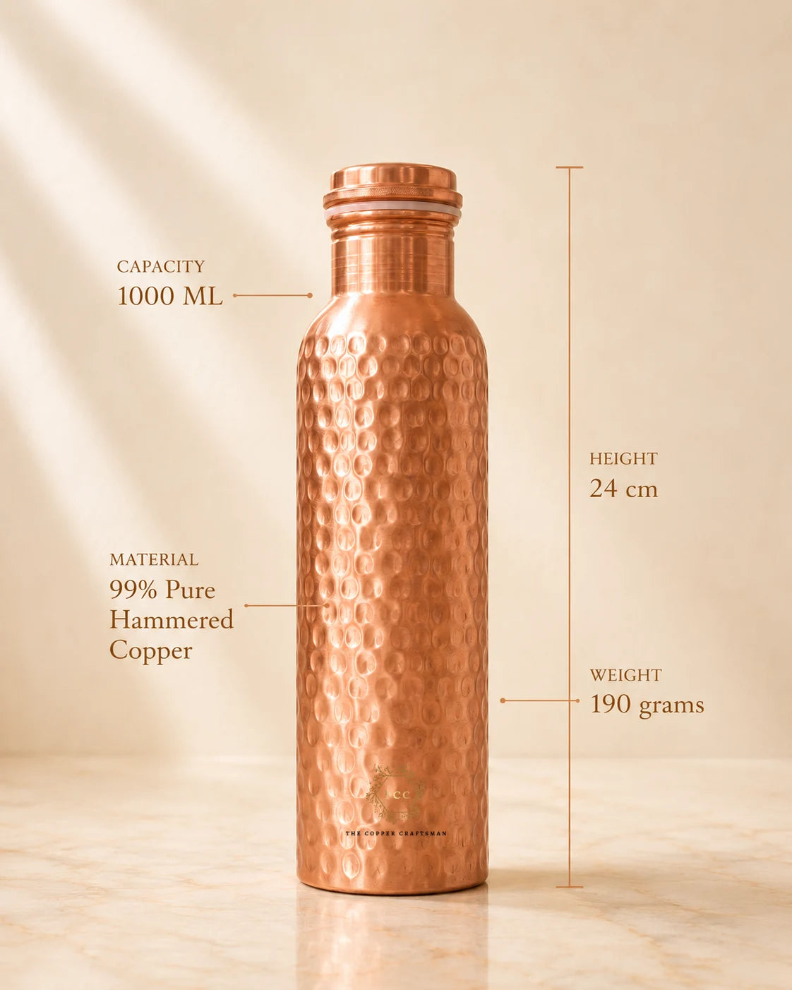 A hammered copper water bottle with dimension callouts showing capacity 1000 ML, height 24 cm, and weight 190 grams, on a warm beige background.
