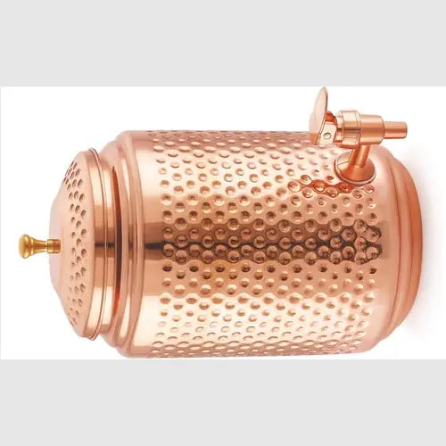 Copper dispenser with textured surface on a white background
