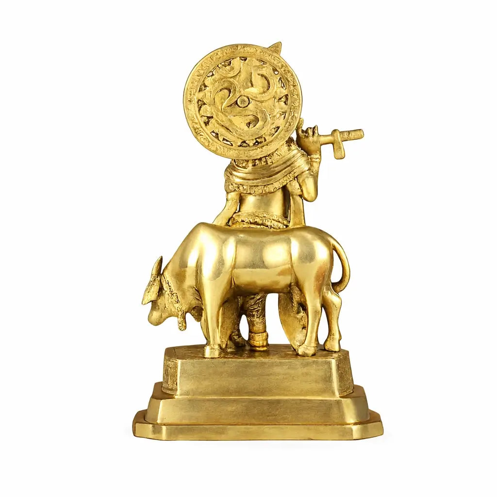 Gold statue of a bull with a figure holding a disc on a white background