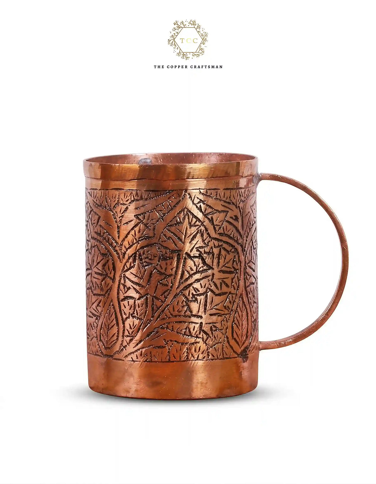 Copper mug with intricate patterns on a white background, branded 'The Copper Craftsmen'.