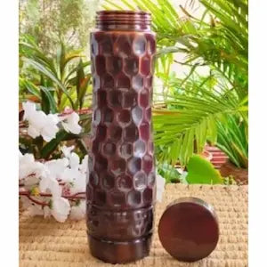 Brown textured bottle with a cap on a natural background