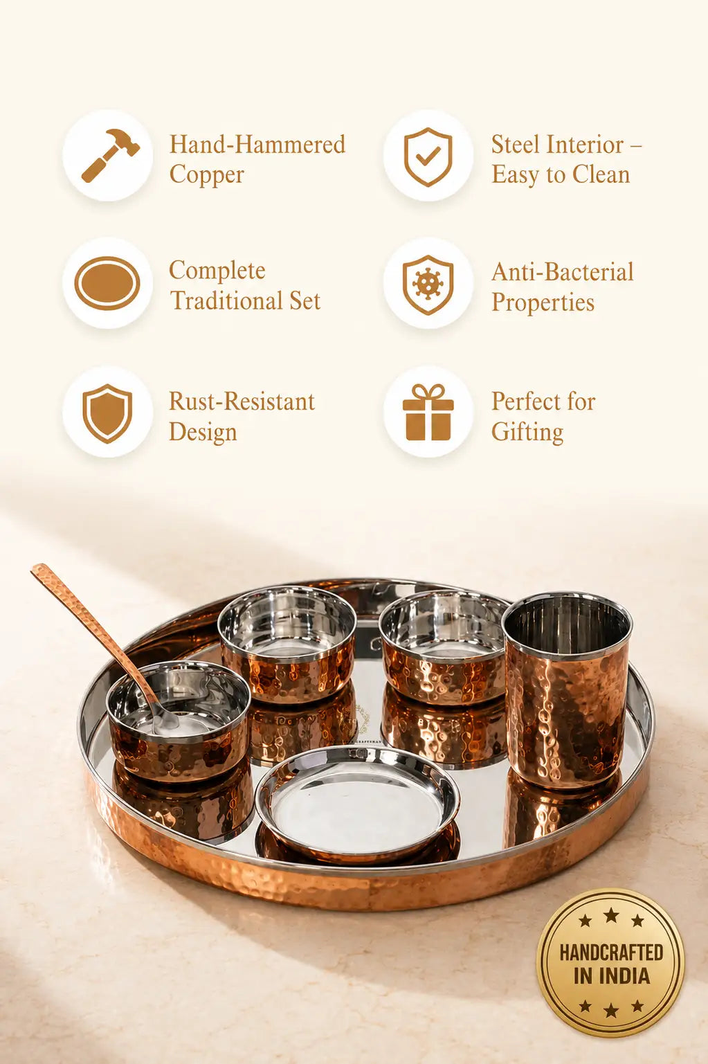 A traditional Indian Copper Dinner Thali Set with Stainless Steel Interior – 7 Piece, featuring a hammered copper outer tray, three copper bowls, two stainless steel bowls, a small copper spoon, and a small brass whisk. The image includes feature icons and text on a cream background.