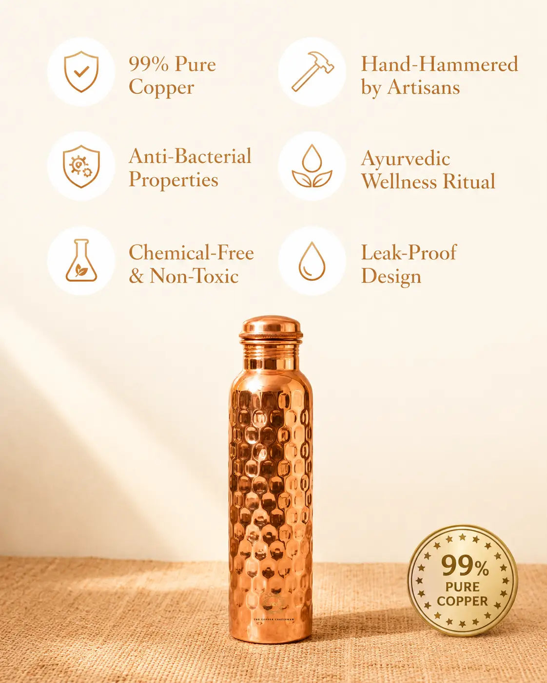 A hammered copper water bottle stands on a burlap surface against a warm cream background, surrounded by feature callouts such as 99% pure copper, hand-hammered by artisans, anti-bacterial properties, ayurvedic wellness ritual, chemical-free and non-toxic, and leak-proof design. A circular badge at lower right repeats 99% pure copper.