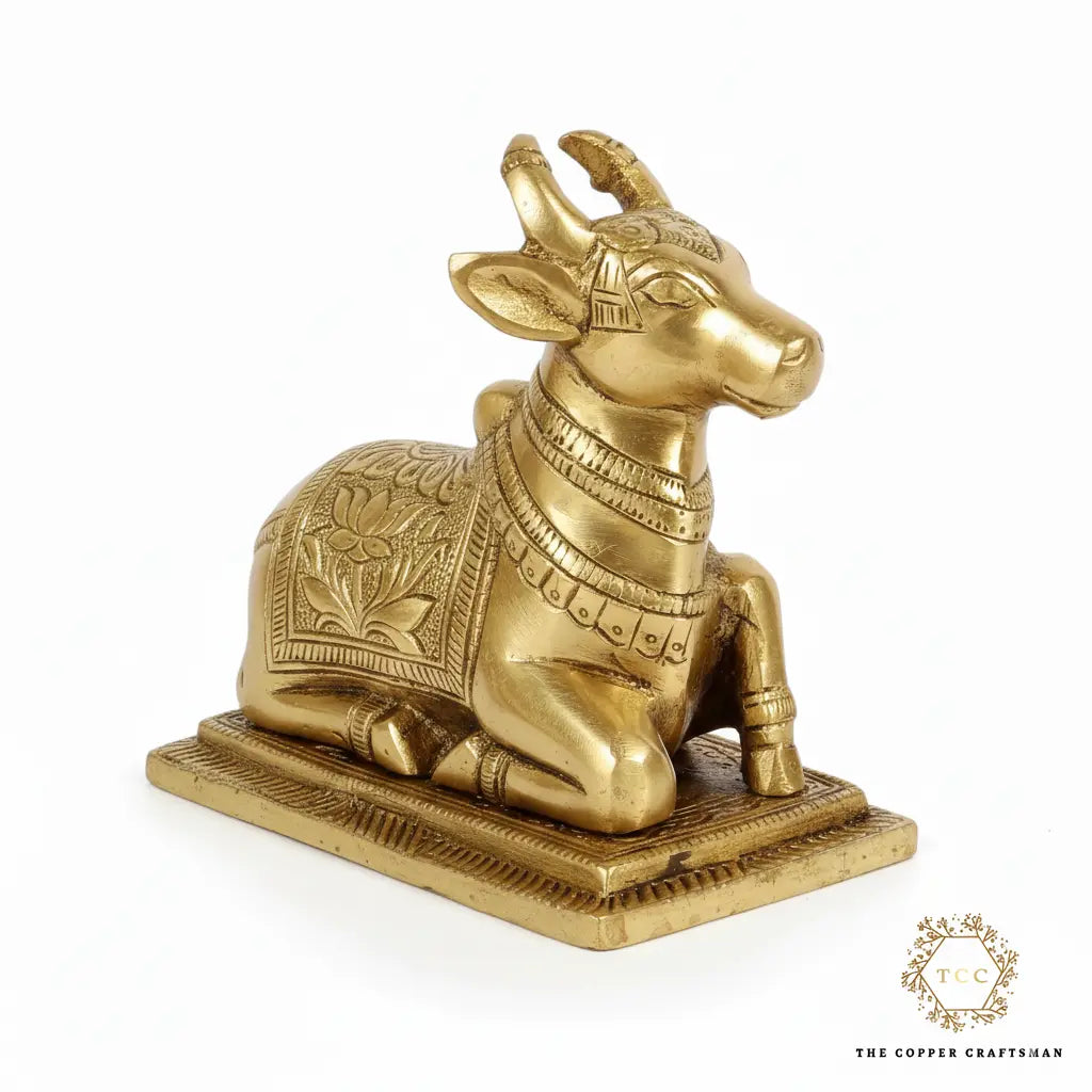 Decorative brass bull statue on a white background