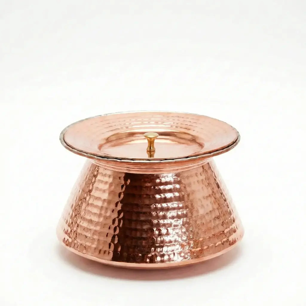 Copper candle holder on a white background