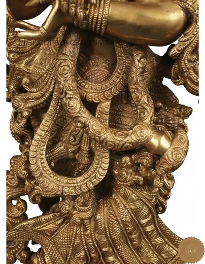Decorative gold sculpture with intricate designs on a white background