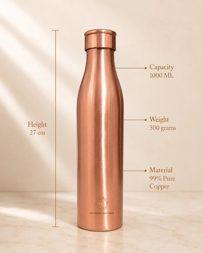 A Traditional Pure Copper Water Bottle 1 L with measurement callouts showing height of 27 cm, capacity of 1000 ml, and weight of 300 grams, made of 99% pure copper.
