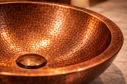 Close-up of a copper sink with a textured surface