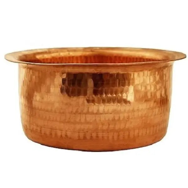 Copper basin with a textured surface on a white background