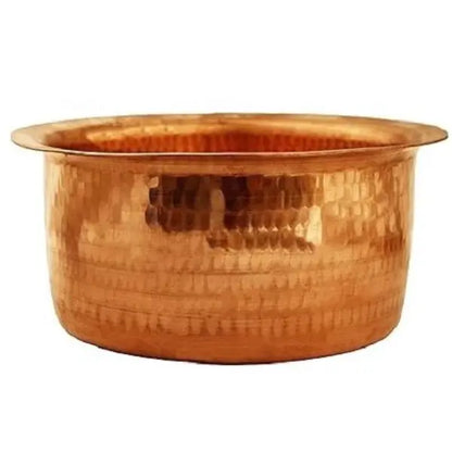 Copper basin with a textured surface on a white background