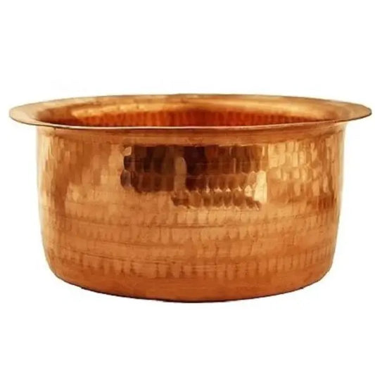Copper basin with a textured surface on a white background