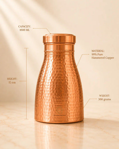 A hammered Copper Bedroom Jar 1L measurement callouts showing capacity 1000 ml, height 15 cm, and weight 300 grams, on a warm beige background.
