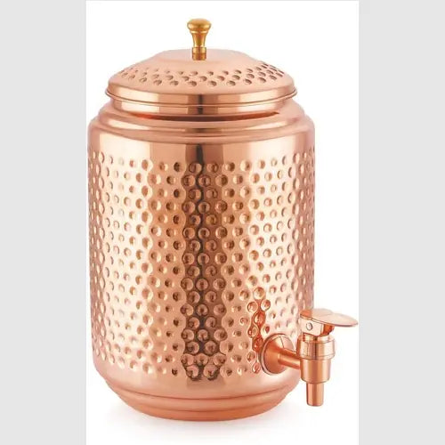Copper dispenser with textured surface and spout on a white background