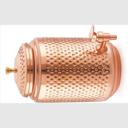 Copper dispenser with textured surface on a white background