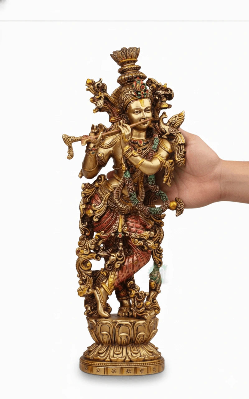 Decorative statue held by a hand on a white background