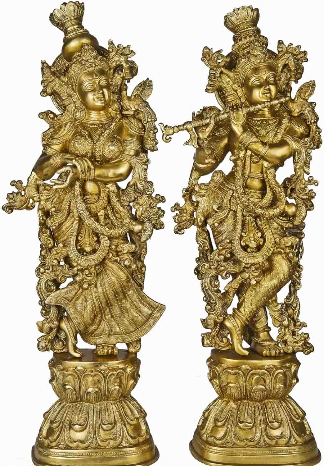 Two ornate gold statues on a white background